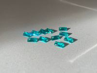 gemstones on a light gray surface
