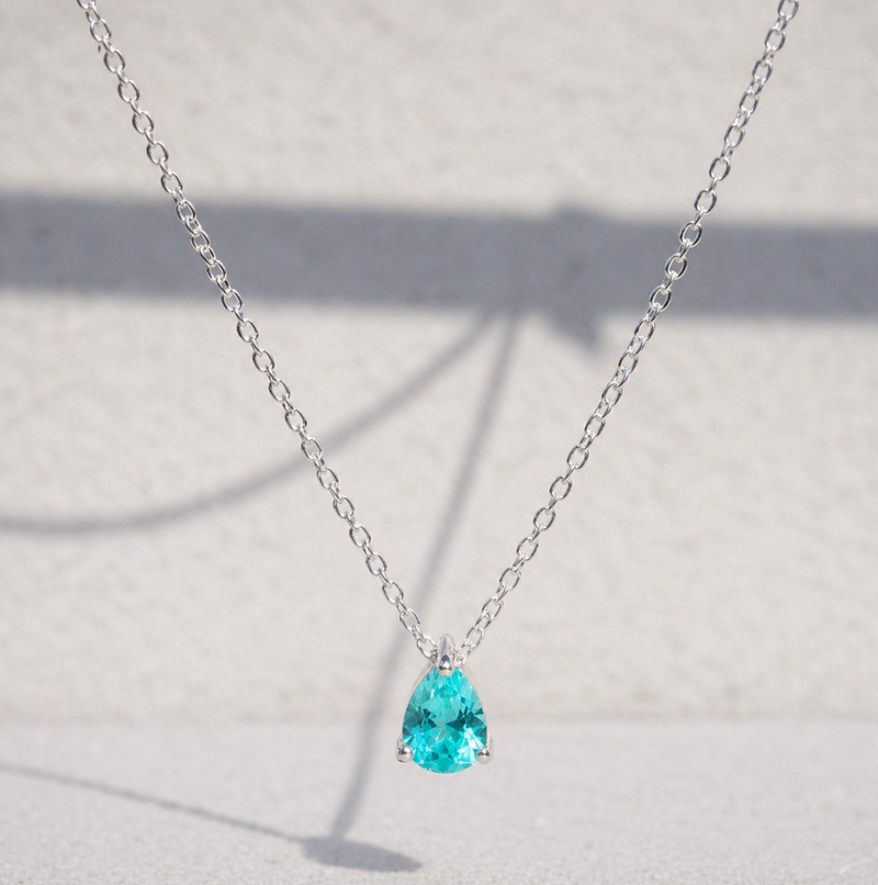 Paraiba Tourmaline Pear Cut Pendant Necklace on a white background